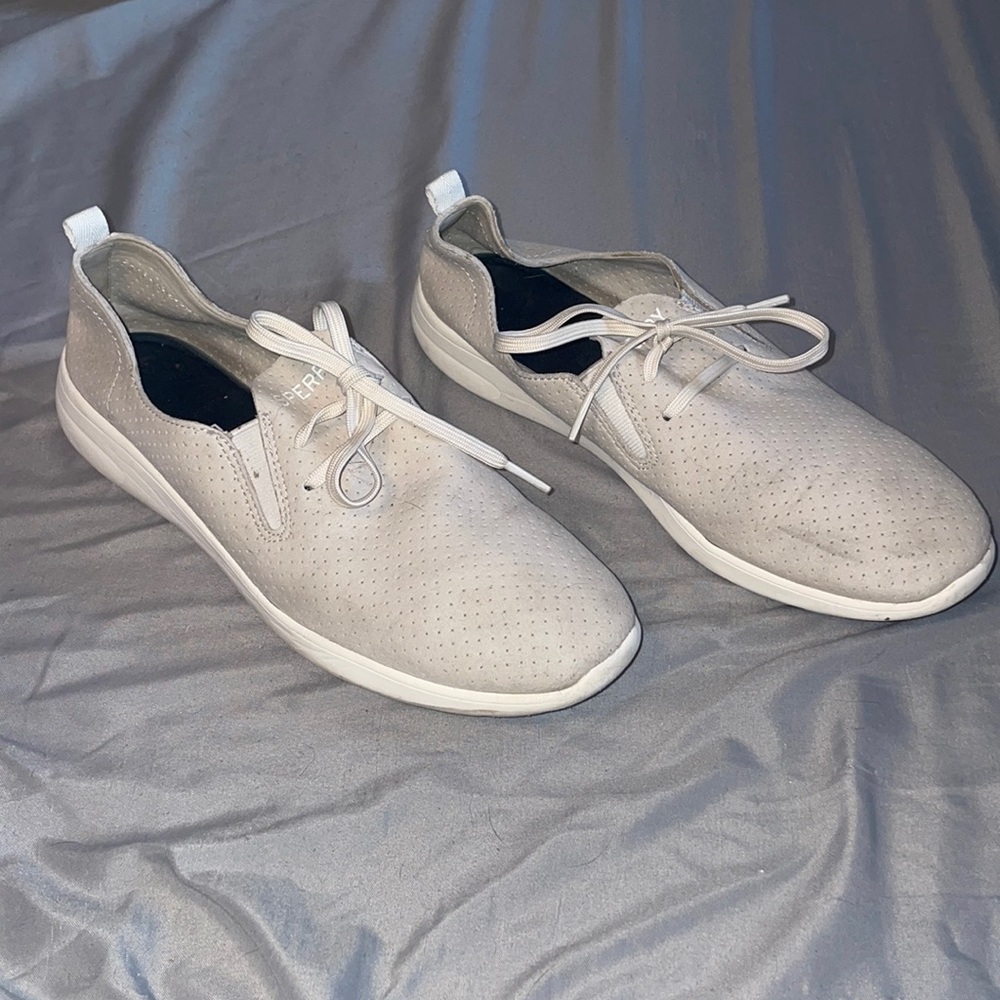 Sperry slip on sneakers.